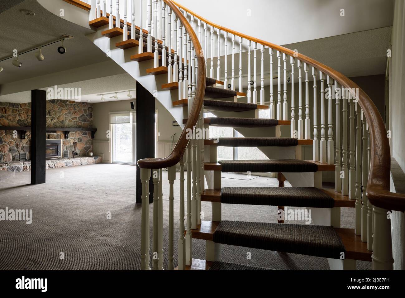 A curved staircase inside a house. This house has since been demolished. Stock Photo