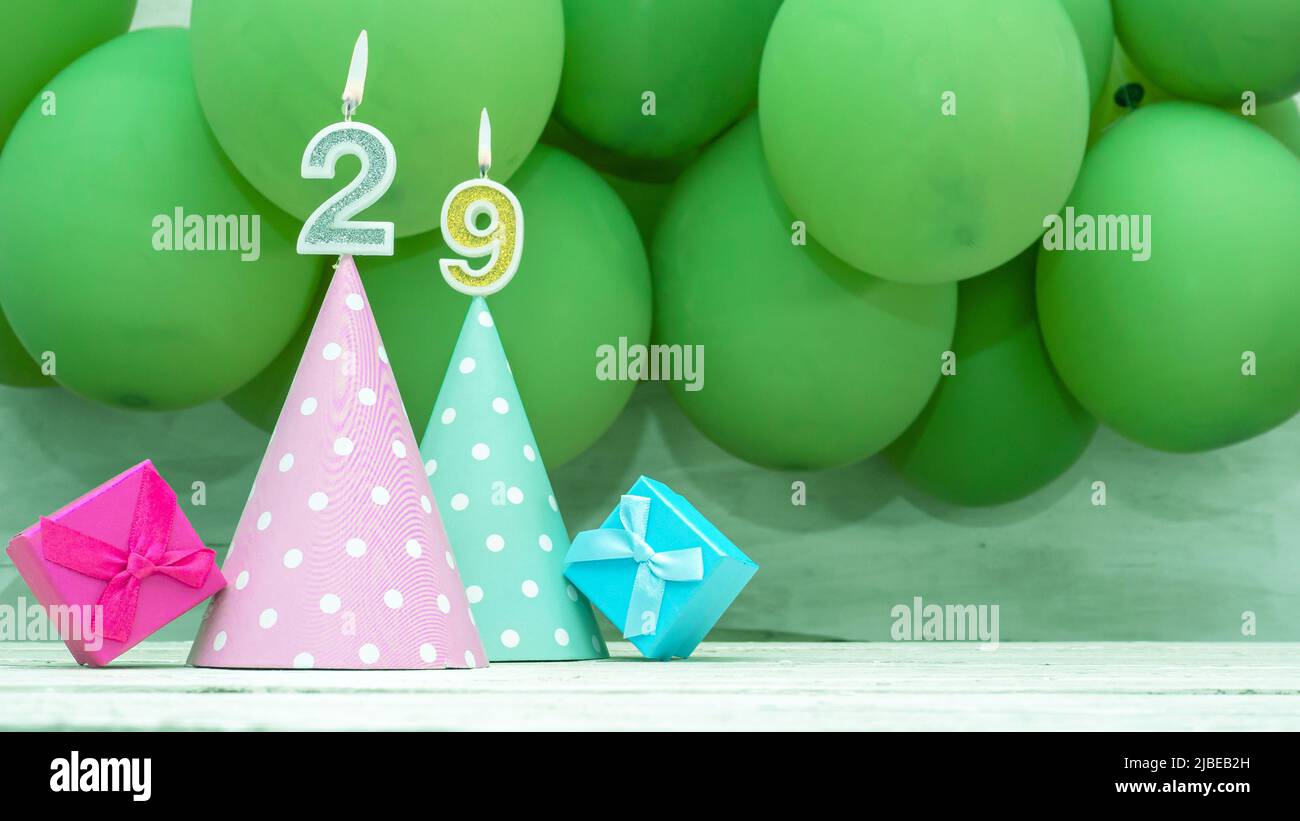 Birthday number, a beautiful card with balloons and numbers from candles, a happy birthday background for a girl. Stock Photo