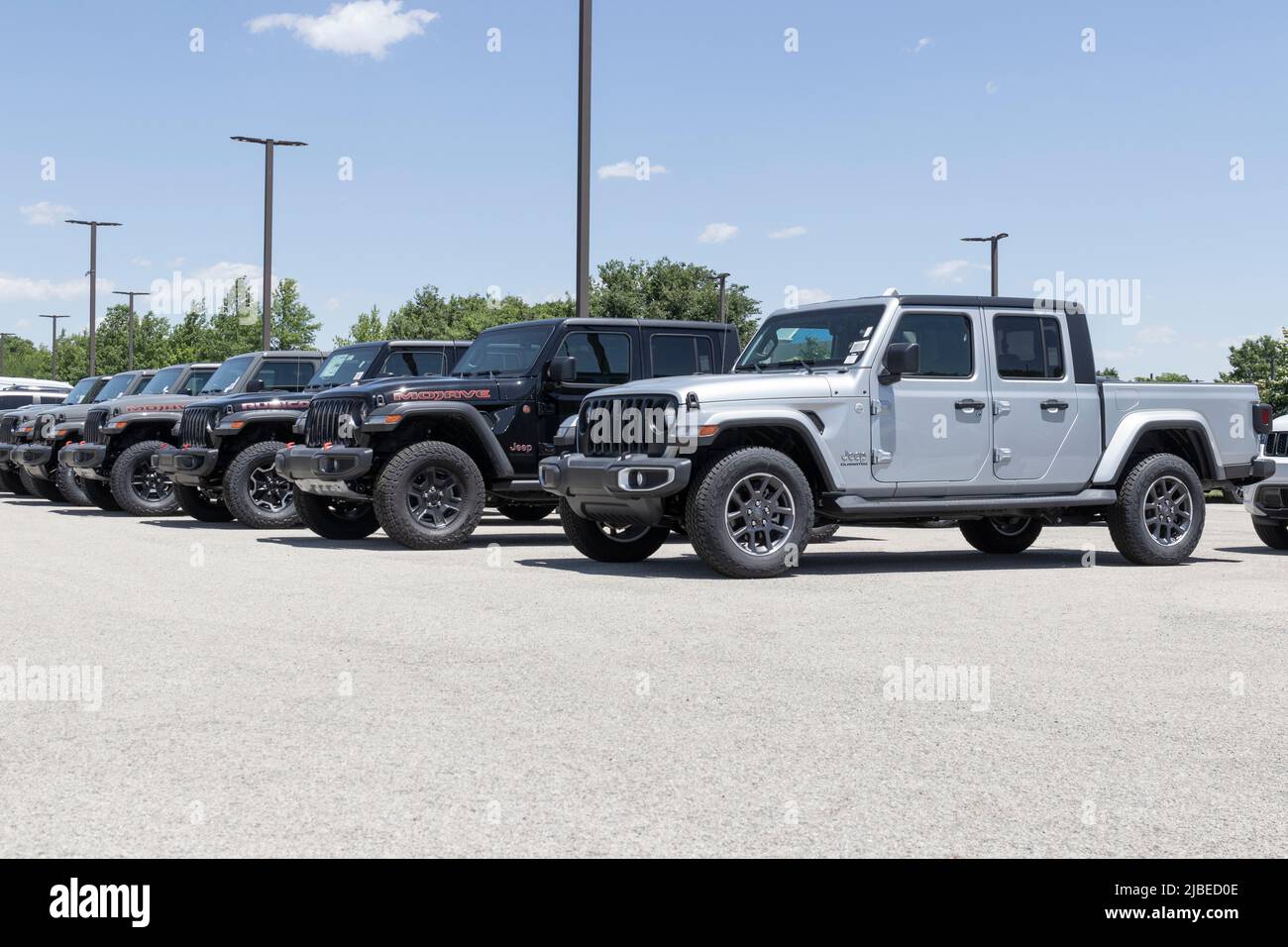Indianapolis - Circa June 2022: Jeep Gladiator display at a Stellantis dealer. The Jeep Gladiator models include the Sport, Willys, Rubicon and Mojave Stock Photo