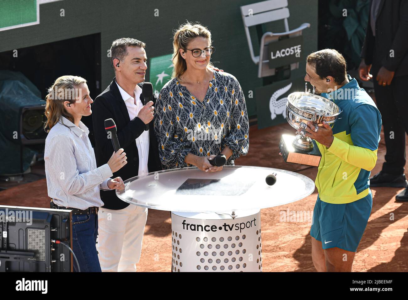 Paris, France - 05/06/2022, Rafael 'Rafa' Nadal of Spain with the trophy is interviewed by the French television channel 'France Televisions' ('France TV Sport', 'France 2') with Justine Henin, Laurent Luyat and Mary Pierce after the French Open final against Casper Ruud, Grand Slam tennis tournament on June 5, 2022 at Roland-Garros stadium in Paris, France - Photo: Victor Joly/DPPI/LiveMedia Stock Photo