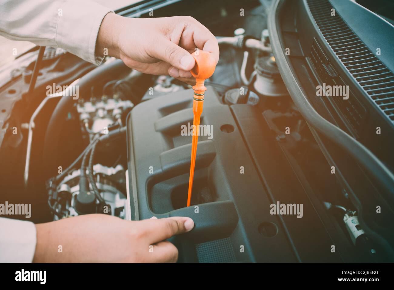 Car Engine oil maintenance repair automotive worker.Focusing soft