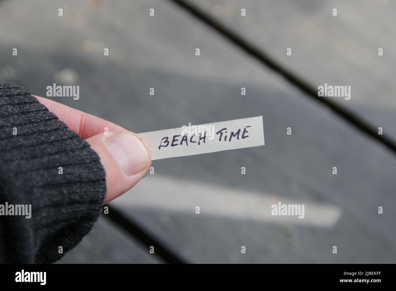 Beach time concept. Paper card with an inscription. Summer Vacations concept.  Stock Photo