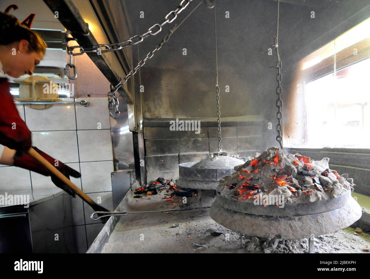 A traditional Sač oven in Bosnia. Bosnians use this oven for baking the Burek ( Pita ) and meat dishes. Stock Photo