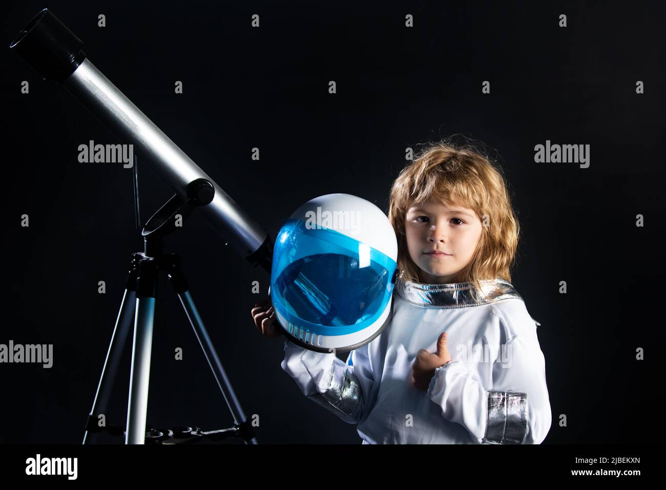 Kid boy exploring space. Portrait of cute kids in space suits with a ...