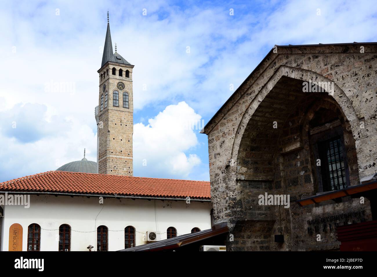Gazi Husrev-beg Mosque, clock tower and other historical buildings in the old town in Sarajevo, Bosnia & Herzegovina. Stock Photo