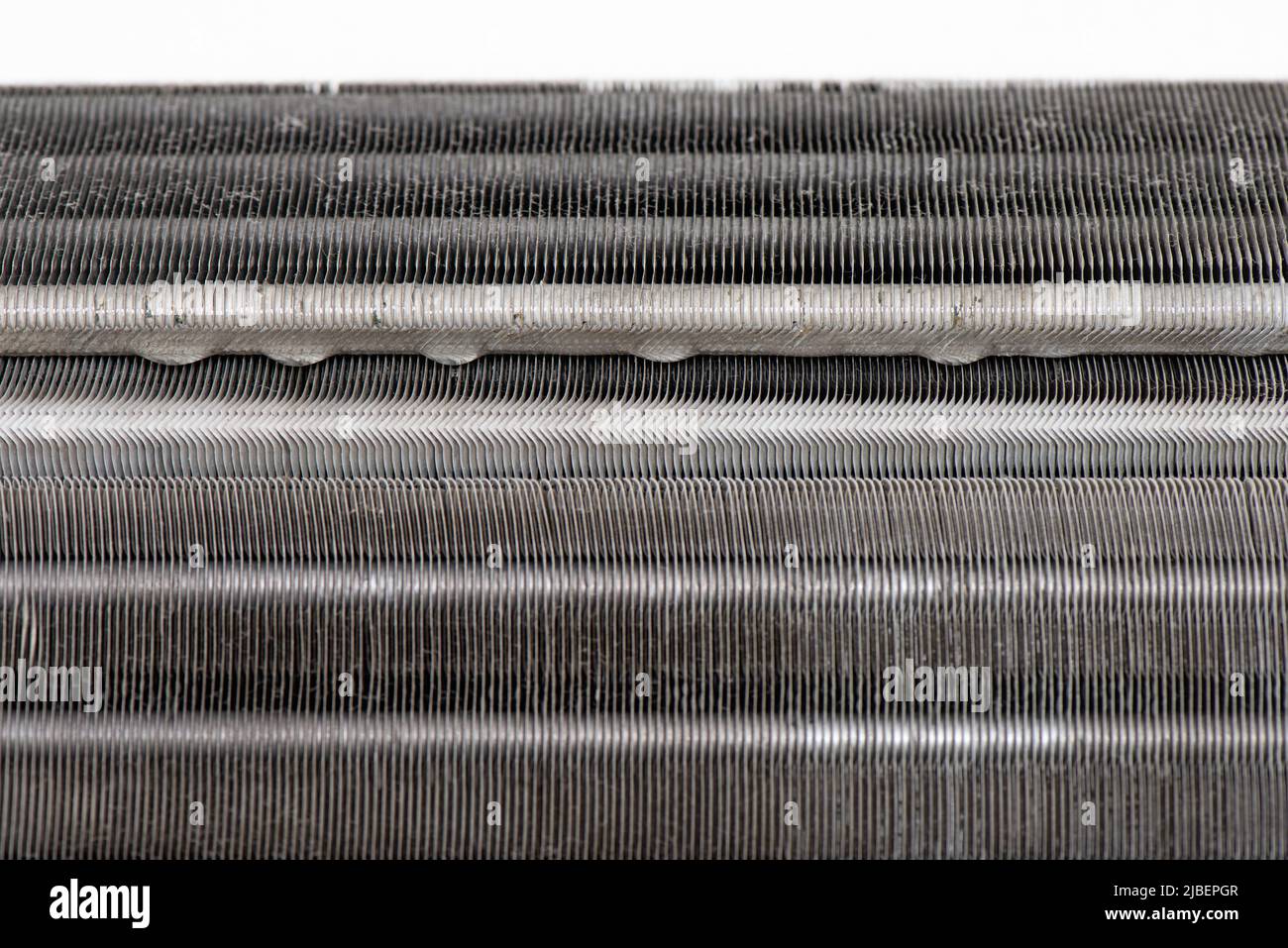 Closeup drops on fan coil unit. Condensation on air conditioner Stock