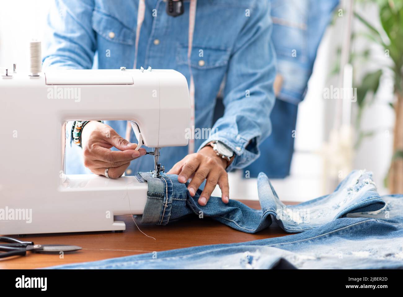 blue denim jeans. Tailor hem 