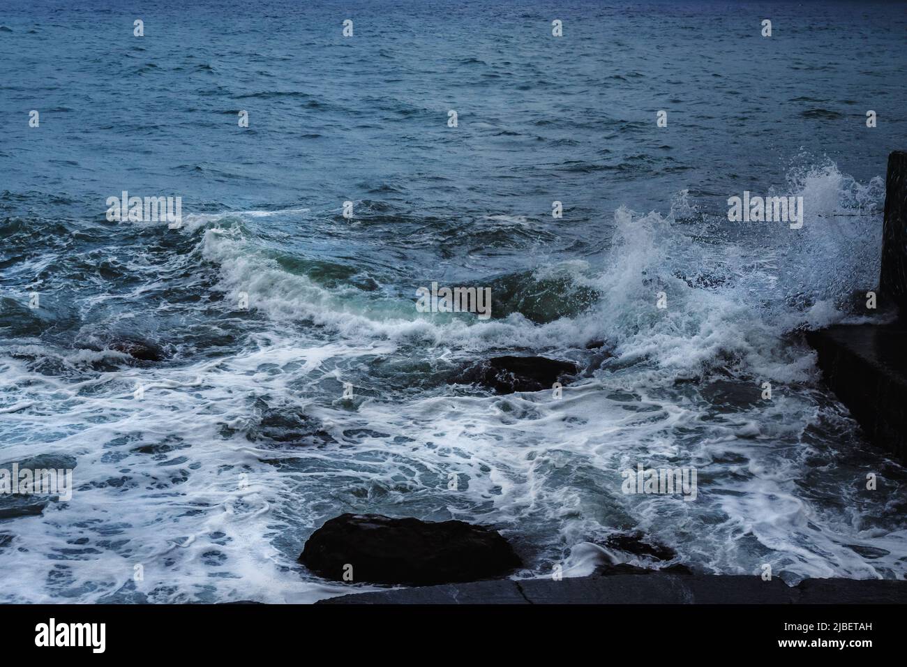 Storm at Black sea in spring. Sea view with waves during rain and cloudy in Alupka. Crimea Stock Photo
