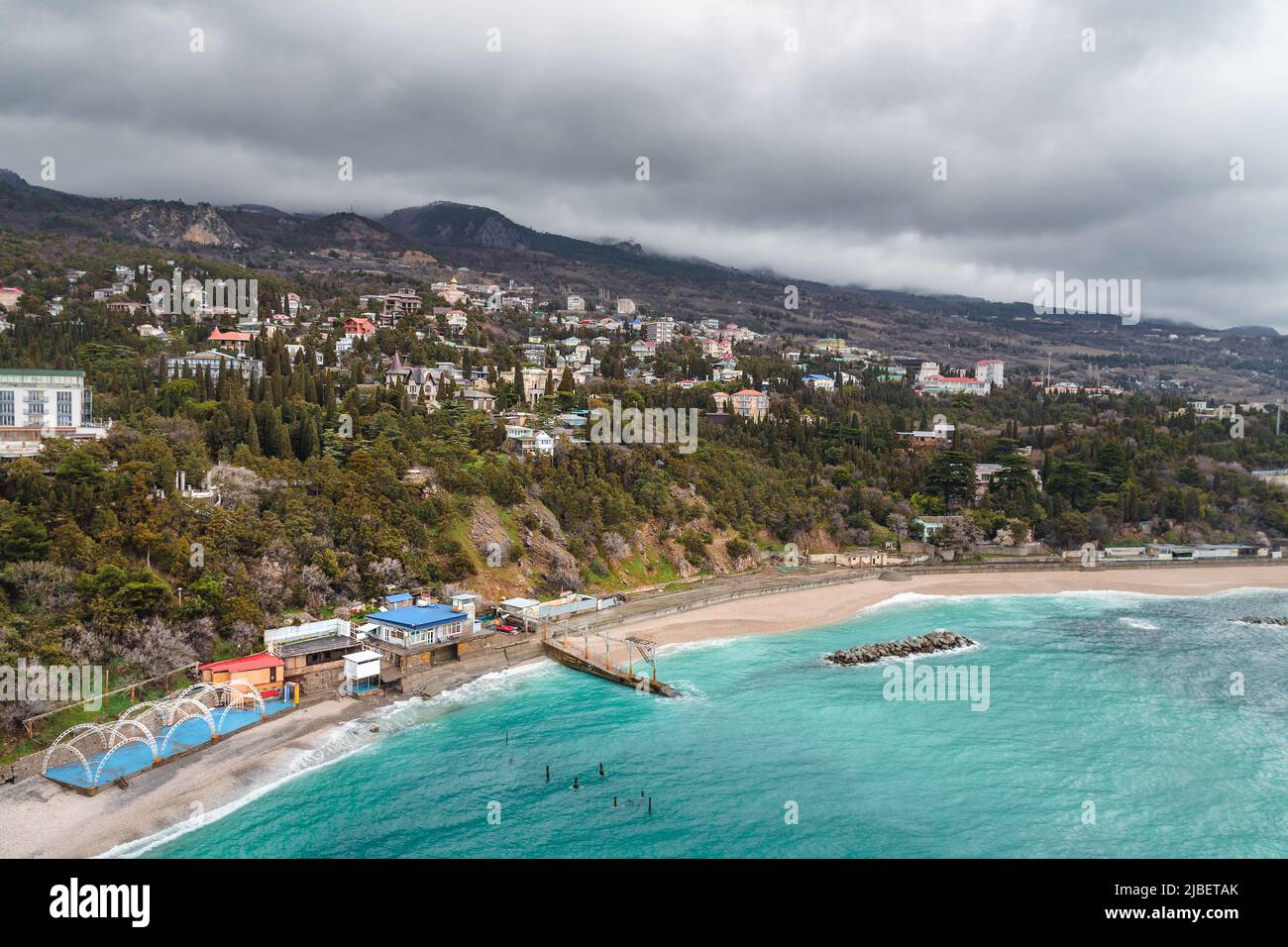 View from a rock Diva at city beach on cloudy weather dayin spring. Simeiz, Crimea Stock Photo