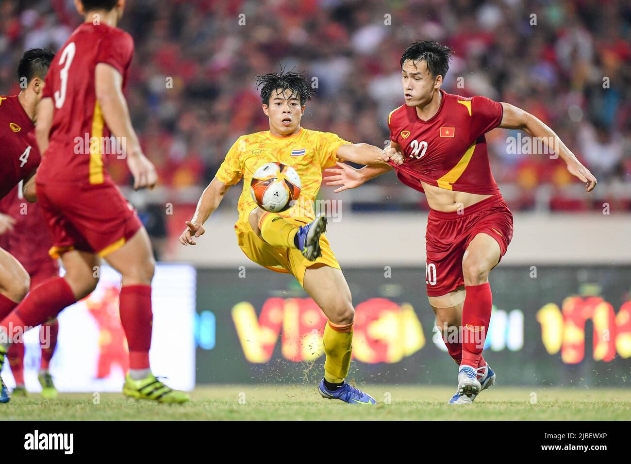 Ekanit Panya (L) of Thailand and Anh Bui Hoang Viet (R) of Vietnam in action during the Sea Games 2022 match between Thailand and Vietnam at My Dinh National Stadium. Final score; Thailand 0:1 Vietnam. Stock Photo