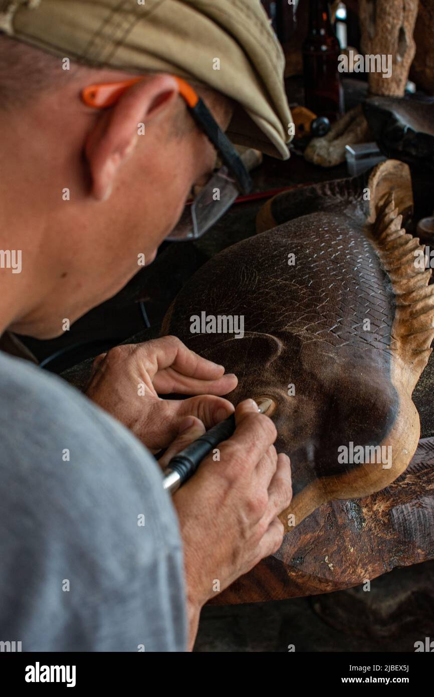 Carpenter working on wood with his hands Stock Photo