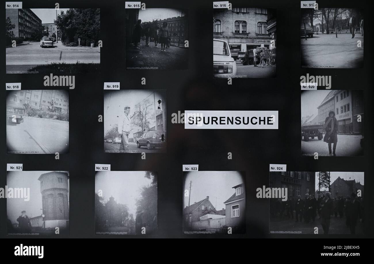 PRODUCTION - 24 May 2022, Saxony-Anhalt, Halle (Saale): 'Spurensuche' (Searching for Traces) is written between photographs that are on display at the Stasi Unterlagenarchiv in Halle/Saale. In the series, the Stasi Unterlagenarchiv exhibits photographs that have not yet been assigned. The archivists hope for further information. (to dpa: 'Help needed for Operation 'Trace Search' in the Stasi Archive in Halle') Photo: Hendrik Schmidt/dpa Stock Photo