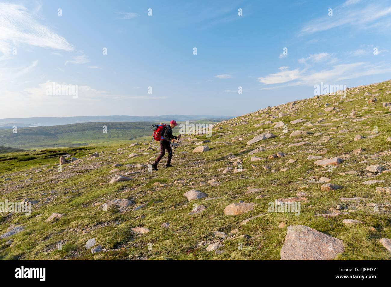 Senior woman hiking on Ronas Hill in Scotland Stock Photo