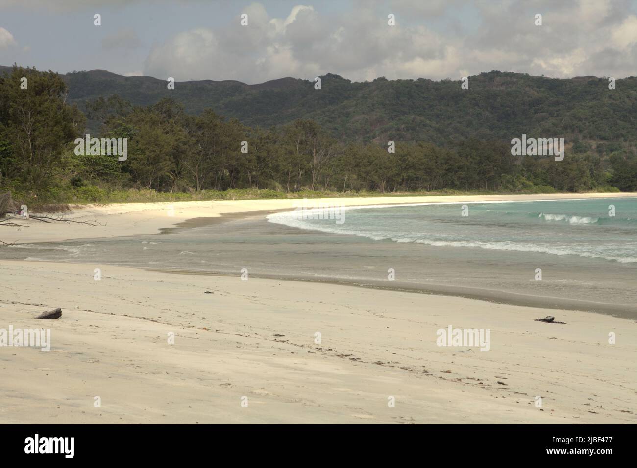 Sandy beach of Tarimbang in Tabundung, East Sumba, East Nusa Tenggara, Indonesia. This beach could be among the half of sandy beaches in the world that could disappear by the end of century if climate change continues unmitigated, as reported by climate scientists in their March 2020 publication on Nature Climate Change. Stock Photo