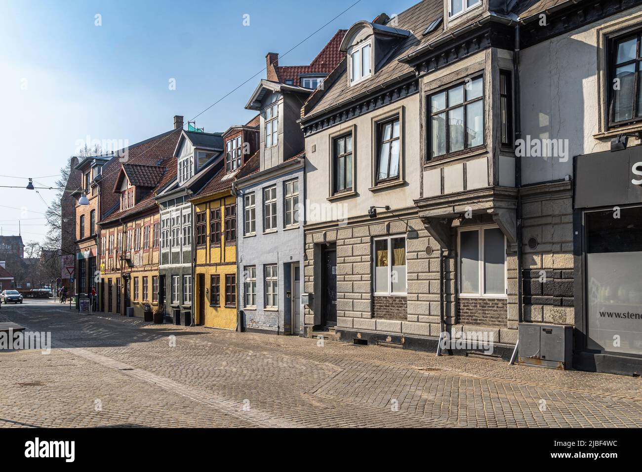 Typical Danish housing architecture. Dormers allow you to take advantage of the space under the roof with windows that catch the light.Odense, Denmark Stock Photo