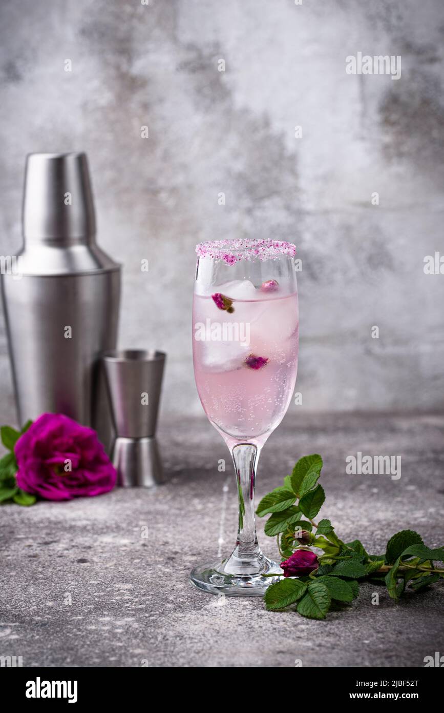 Pink cocktail with champagne and rose syrup Stock Photo - Alamy