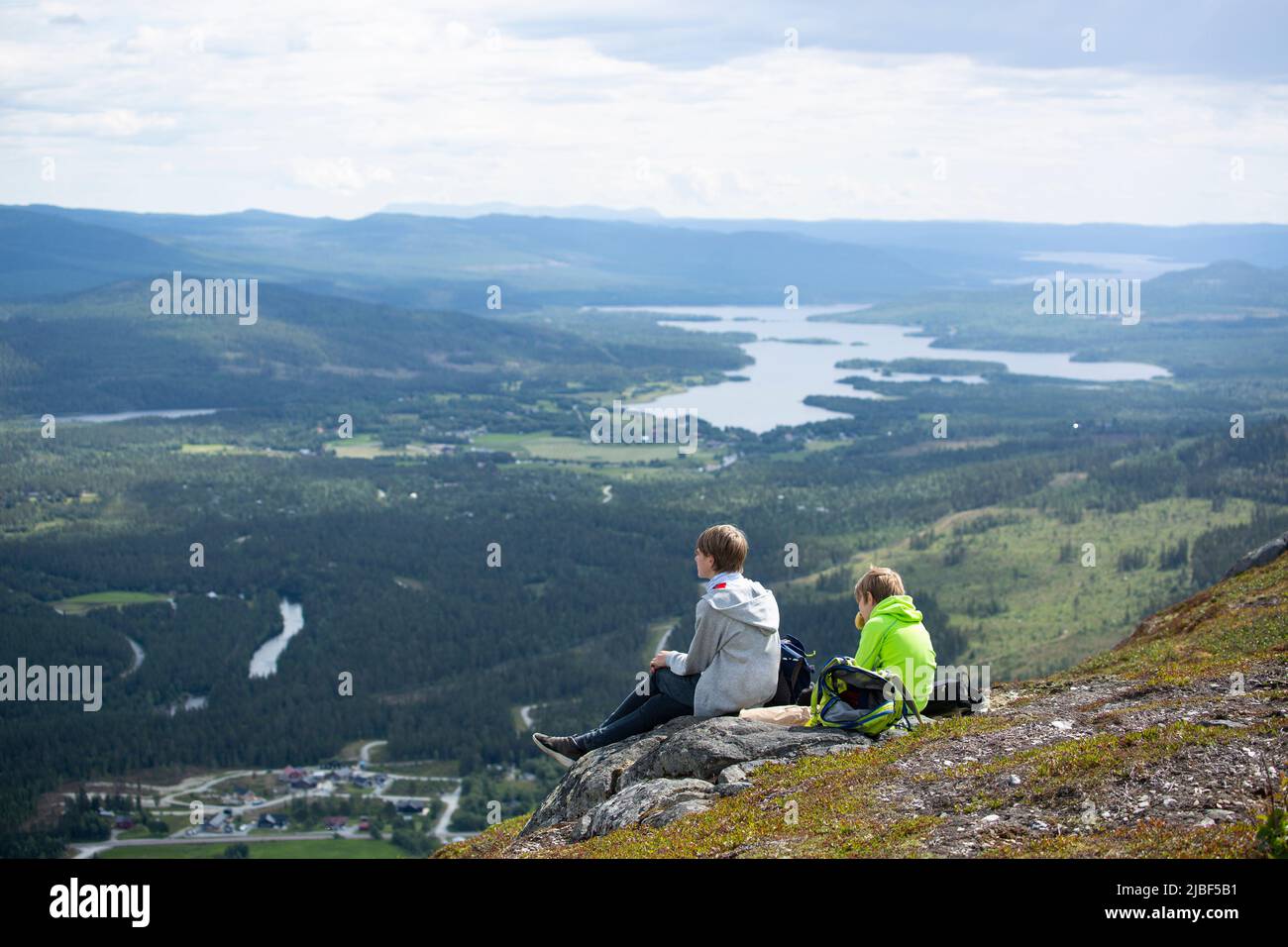 Two boys sitting on rock hi-res stock photography and images - Alamy