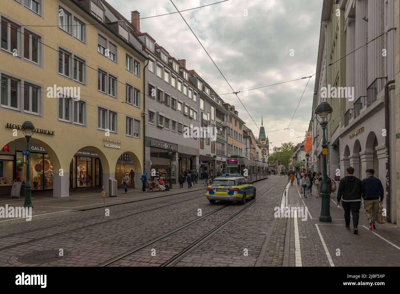 Street with shops and buildings in the historic old town, Freiburg