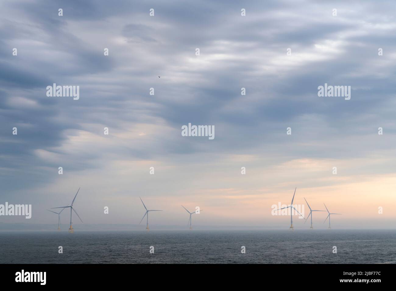 Wind turbines and clouds over North Sea Stock Photo