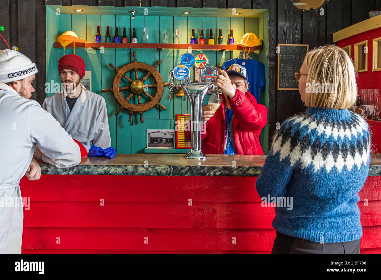 Segull 67 is a small family owned craft brewery located in the fishing village of Siglufjörður, Iceland. Segull means magnet in Icelandic and the magnet needle (magnetic noth) of the compass is part of the logo Stock Photo