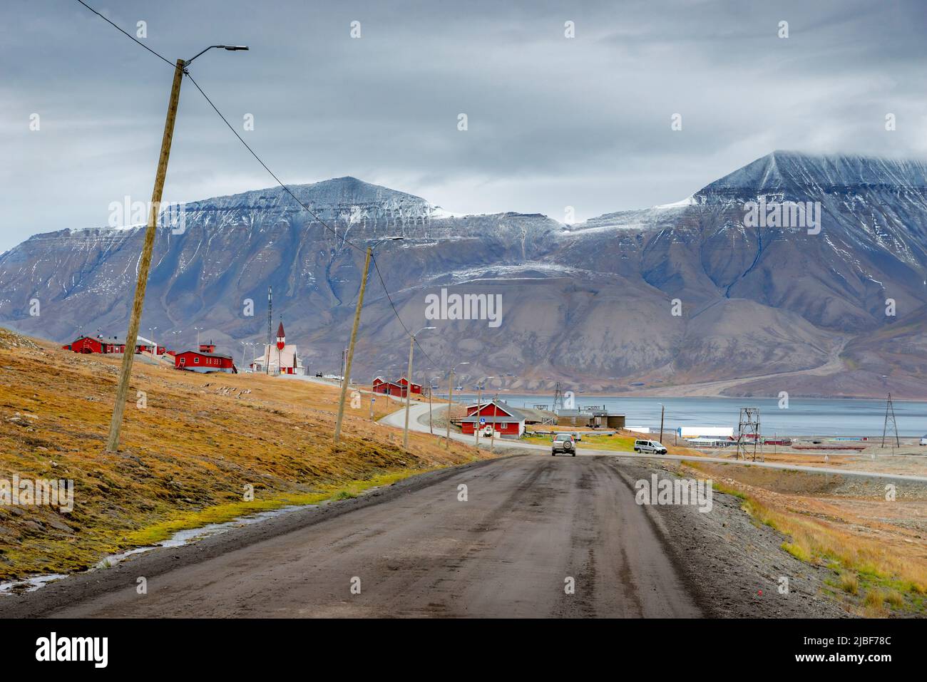 Road to mountains and village in Svalbard, Norway Stock Photo