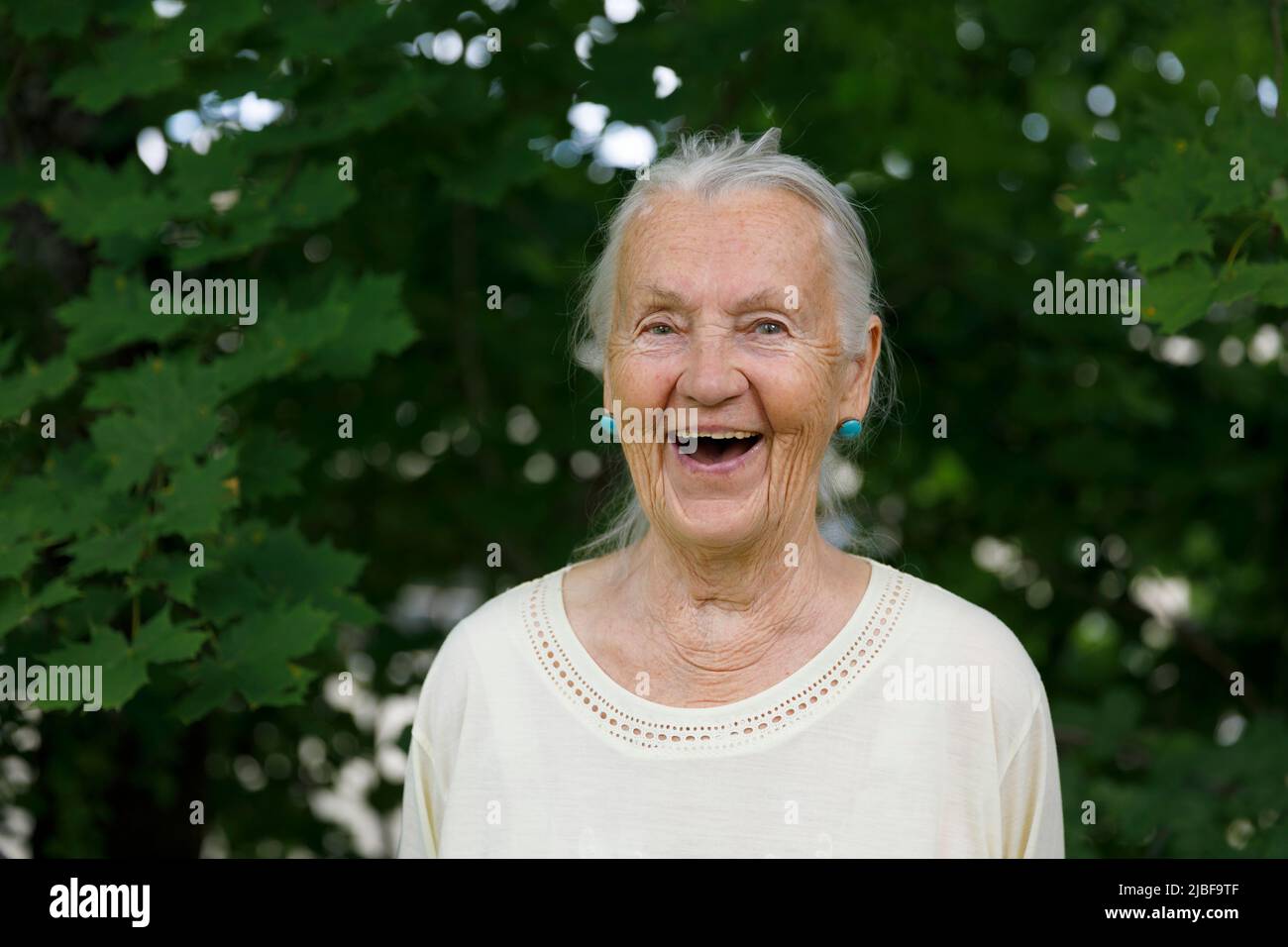 Laughing senior woman Stock Photo