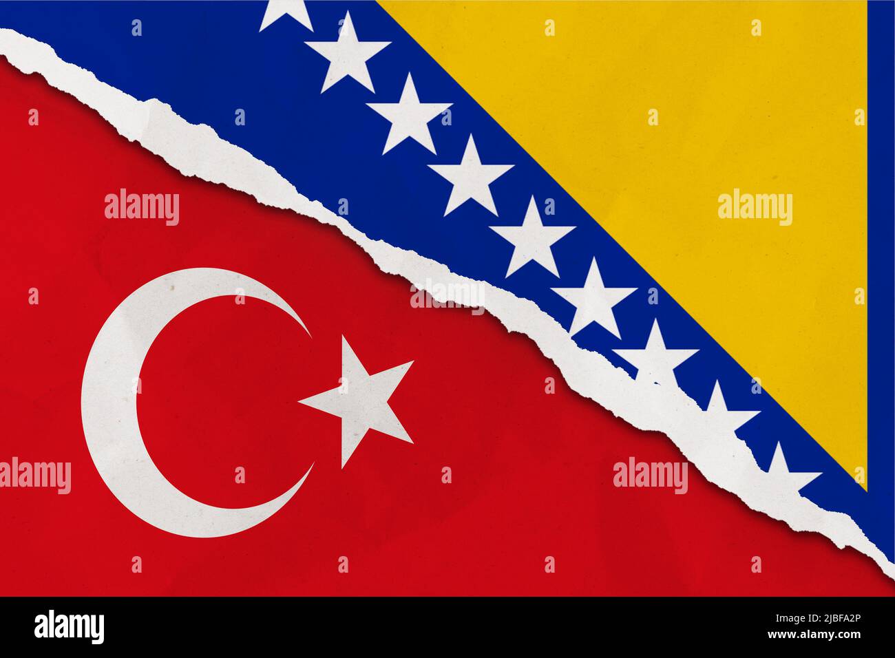 Bosnia and Herzegovina and Turkey flag ripped paper grunge background. Abstract Bosnia and Herzegovina and Turkey economics, politics conflicts, war c Stock Photo
