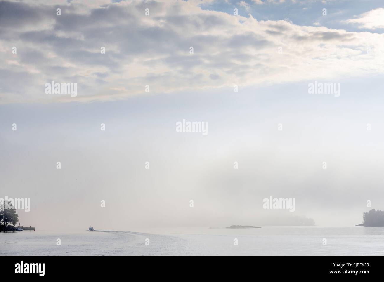 Boat on Baltic Sea under clouds in Lidingo, Sweden Stock Photo