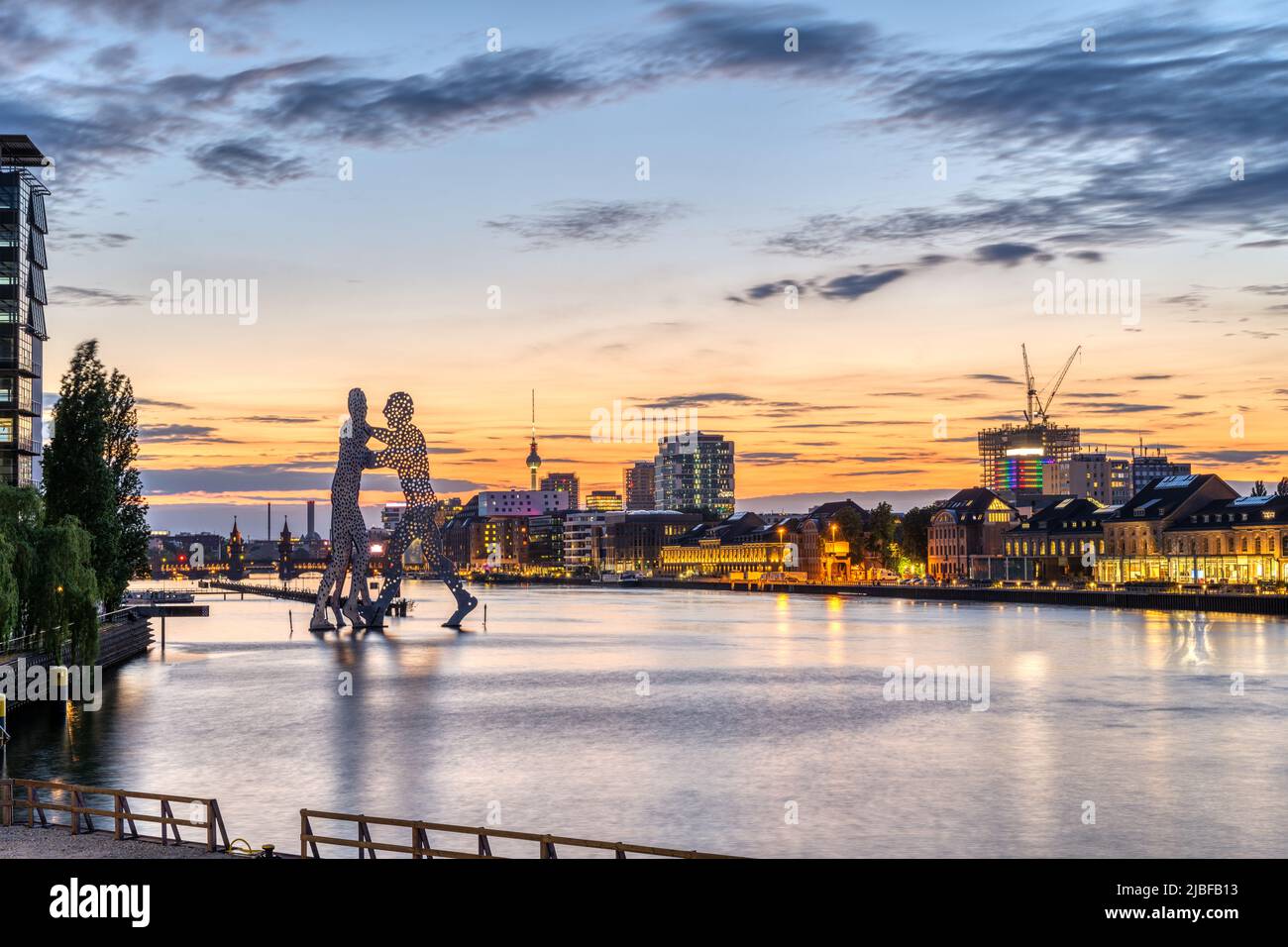 The river Spree in Berlin with the famous TV Tower in the distance after sunset Stock Photo