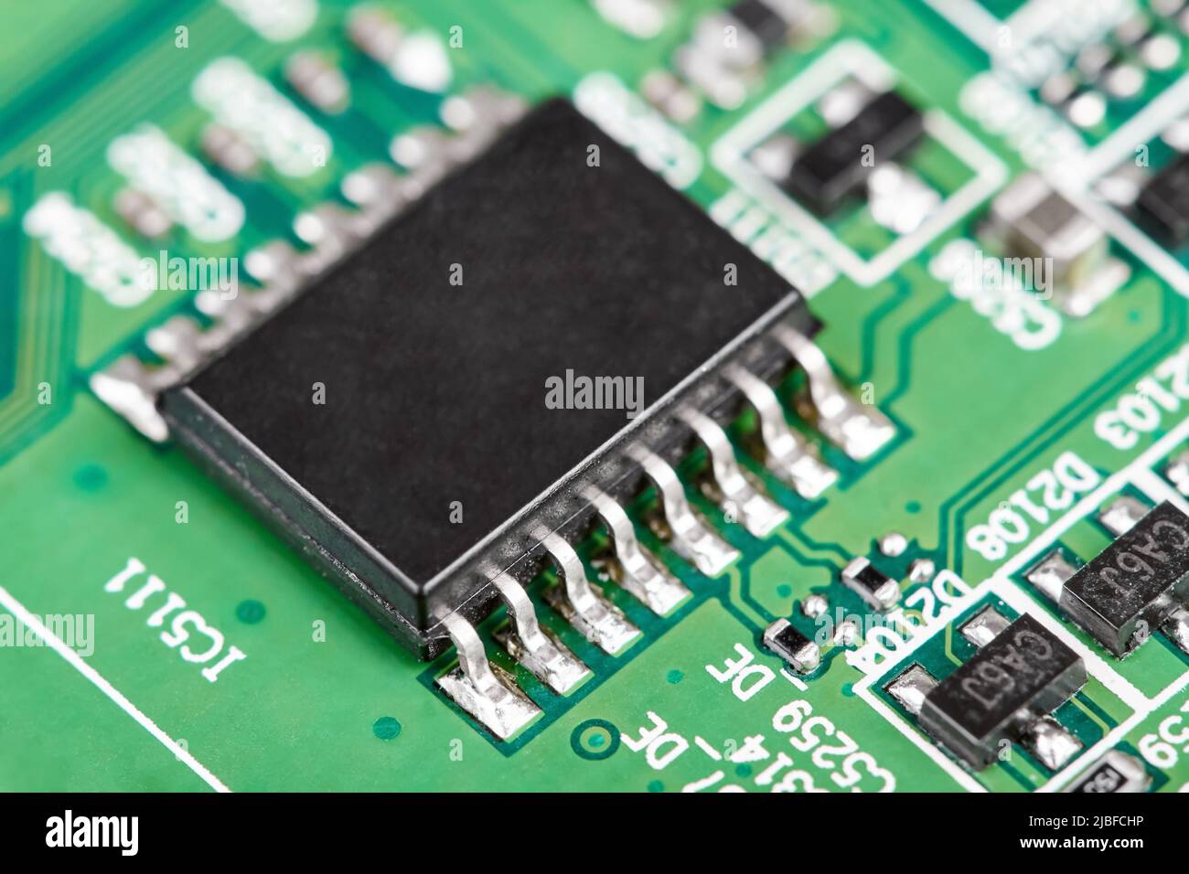 Close-up of a green computer printed circuit board with selective focus ...