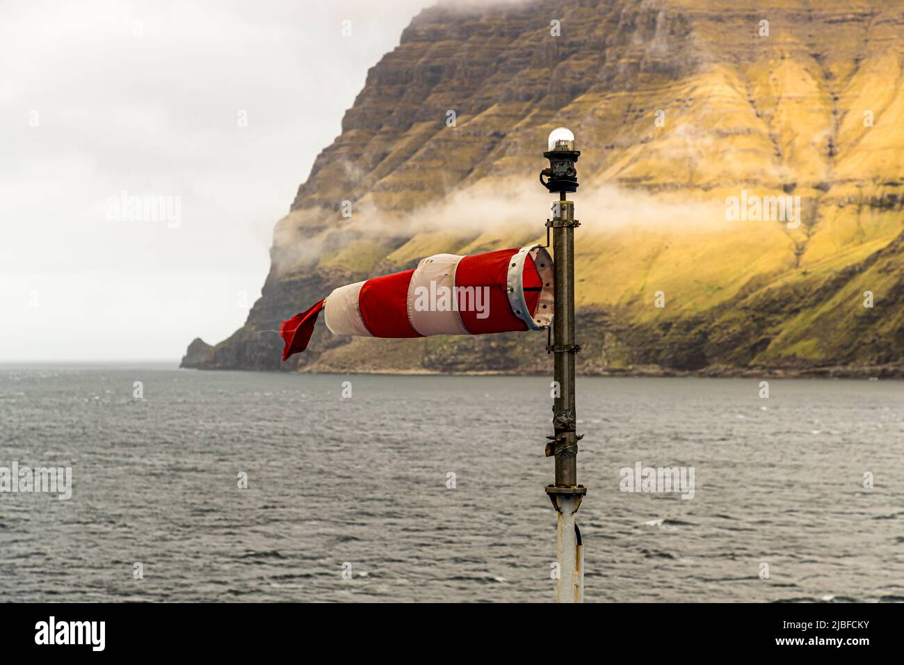 Torn windsock on the stormy Faroe Islands Stock Photo