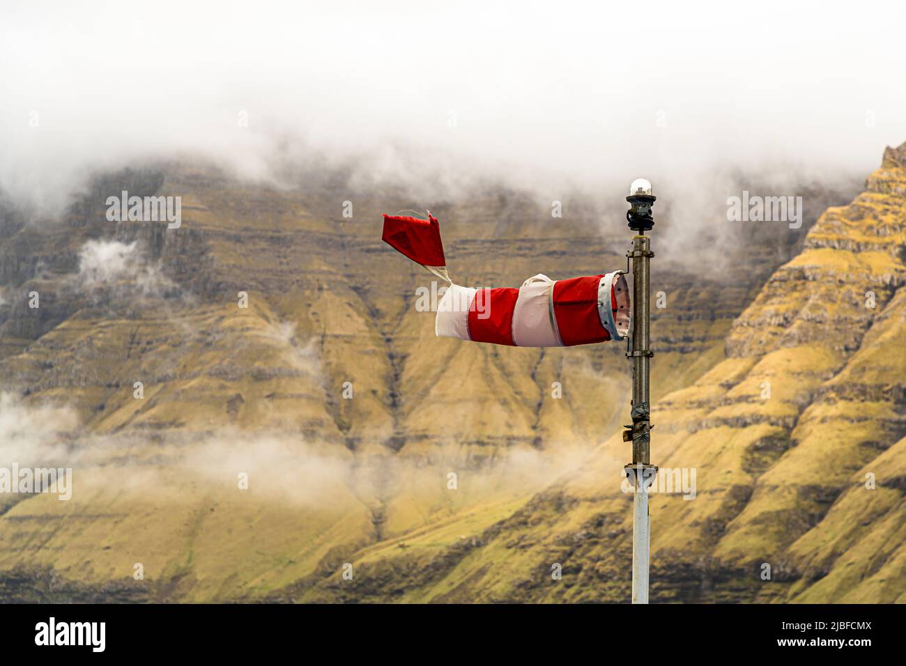 Torn windsock on the stormy Faroe Islands Stock Photo