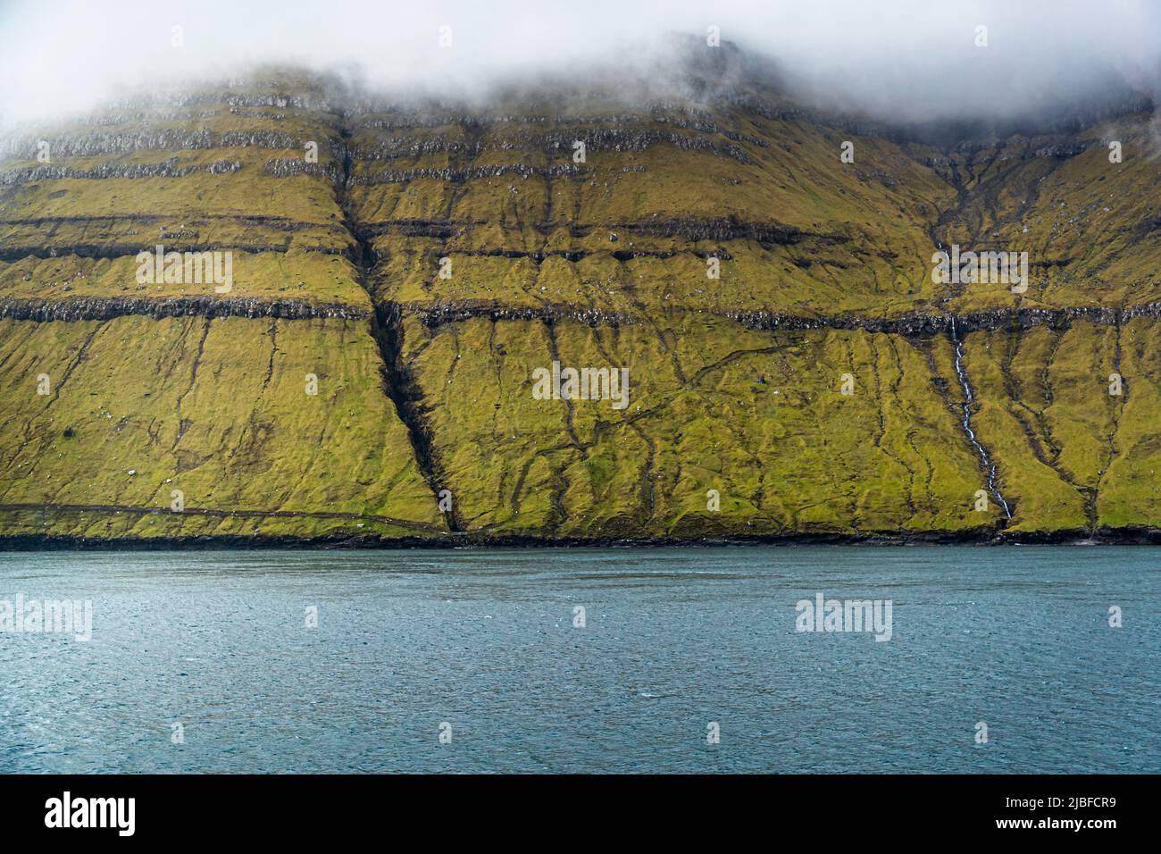 Hiking trail on the cliffs of the Faroe Islands Stock Photo