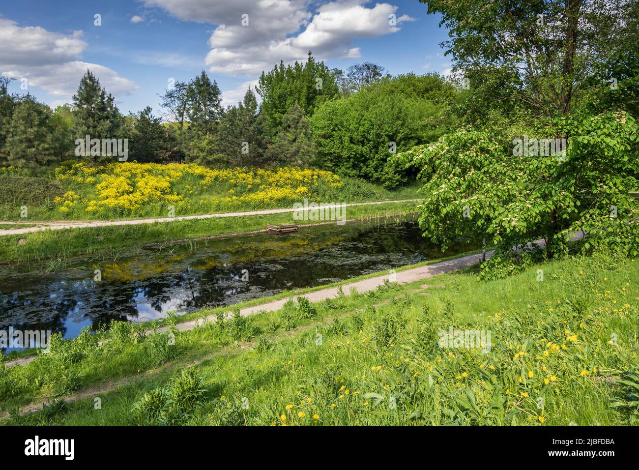 Springtime landscape with canal in Fort Bema park, city of Warsaw, Poland. Stock Photo