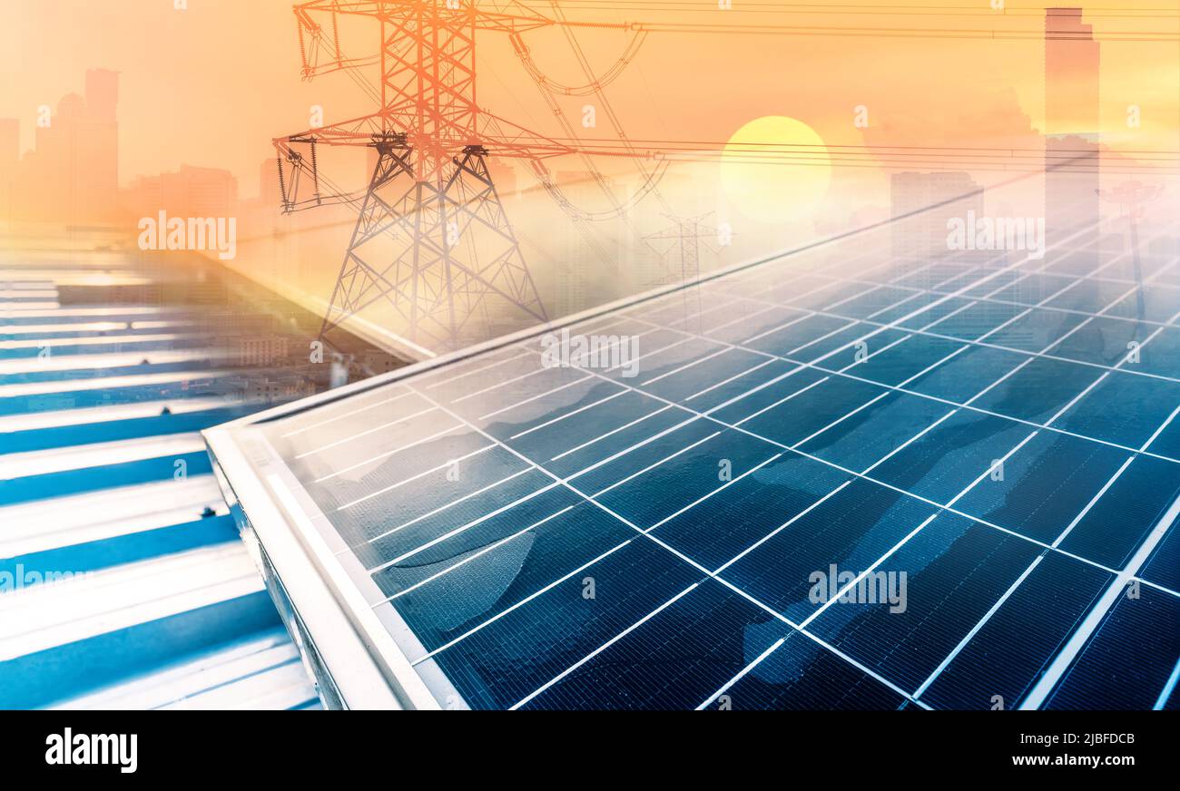 Solar panel or photovoltaic module on blur high voltage electric pylon and skyscraper building