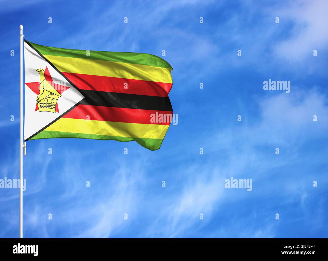 National flag of Zimbabwe on a flagpole Stock Photo Alamy