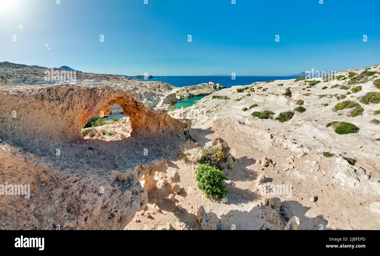 Summer landscape of white rocks, Sarakiniko beach, Aegean sea, Milos island , Greece. No people, empty cliffs, sunshine, clear sea waters, lagoon Stock Photo