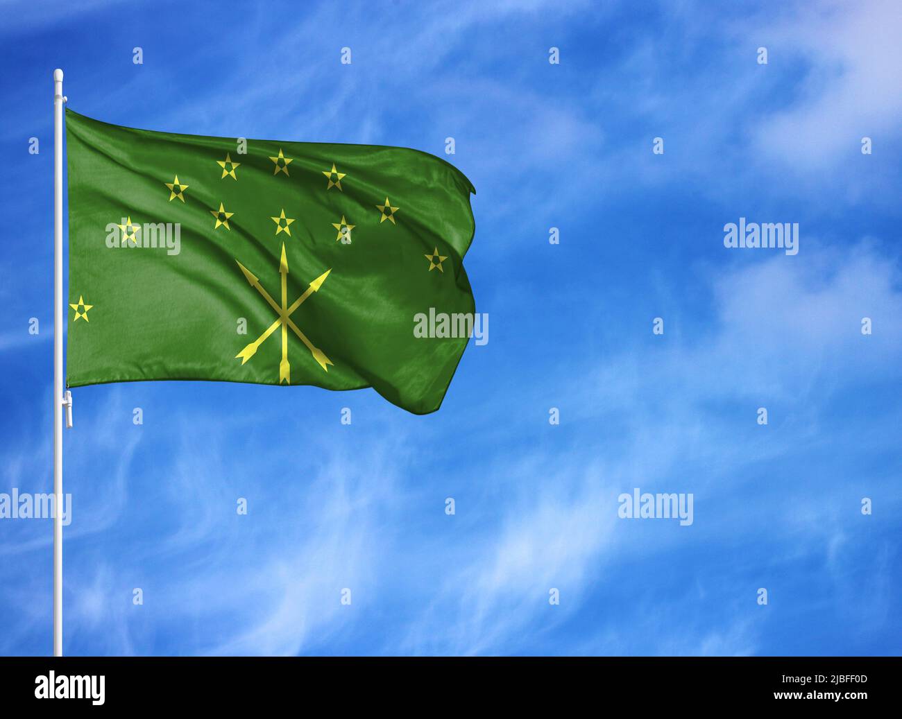 National flag of Adygea on a flagpole Stock Photo