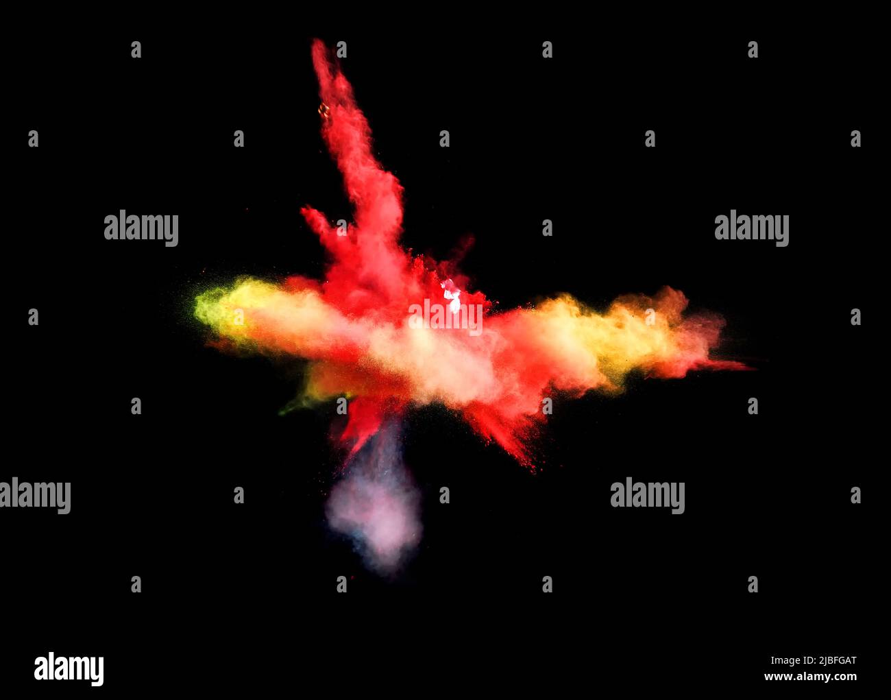 Various multicolored forms of powder paint explode in front of a black ...