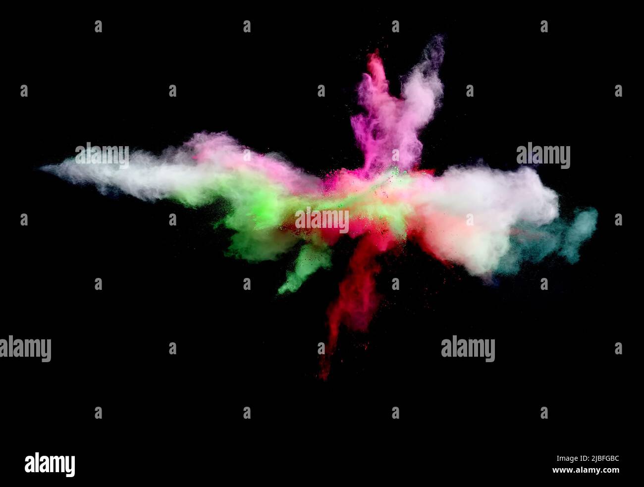 Various multicolored forms of powder paint explode in front of a black ...