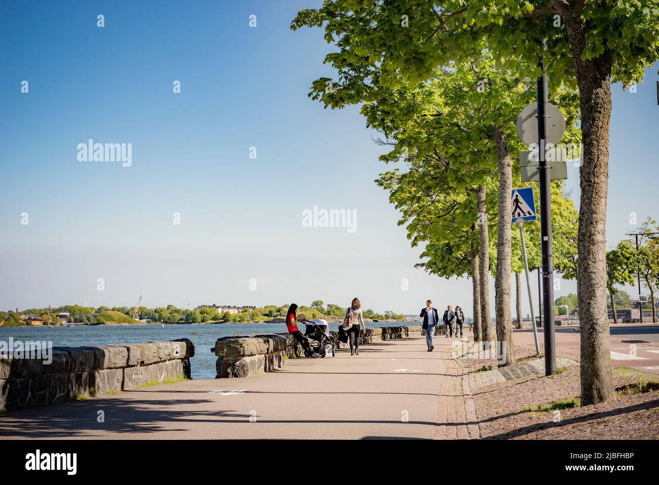 Pedestrians on waterfront in Helsinki, Finland Stock Photo