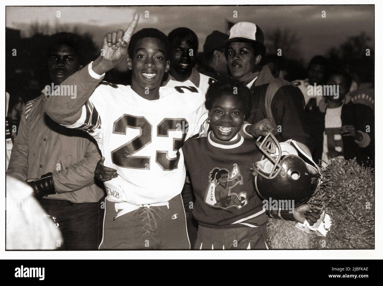 After winning ther game, a Bayside High School football player posed for a photo with is cheerleader girlfriend. In Brooklyn, New York in 1983 Stock Photo