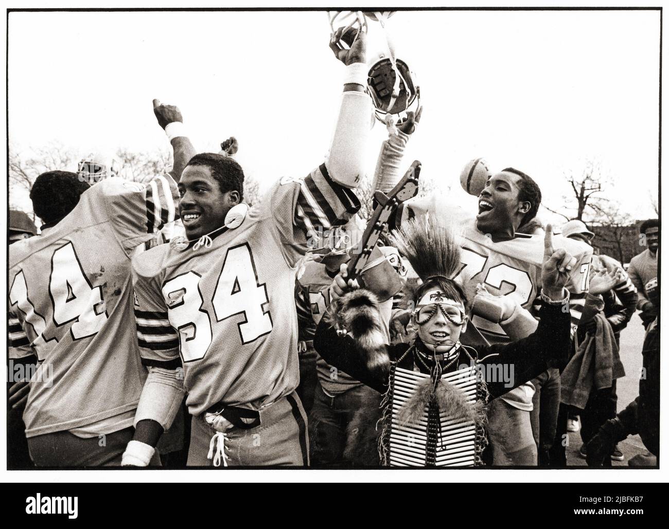 The Canarsie High School football team and their mascot celebrate a