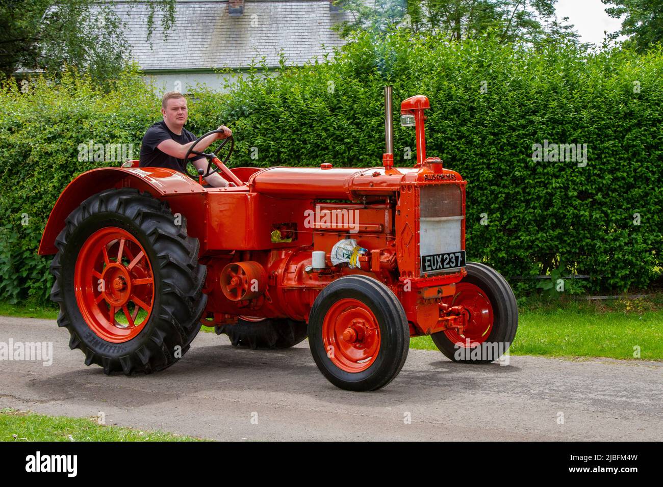 1948, red restored ALLIS CHALMERS  MT 15- 18 Tractor, arriving in Worden Park Motor Village, Leyland, UK Stock Photo