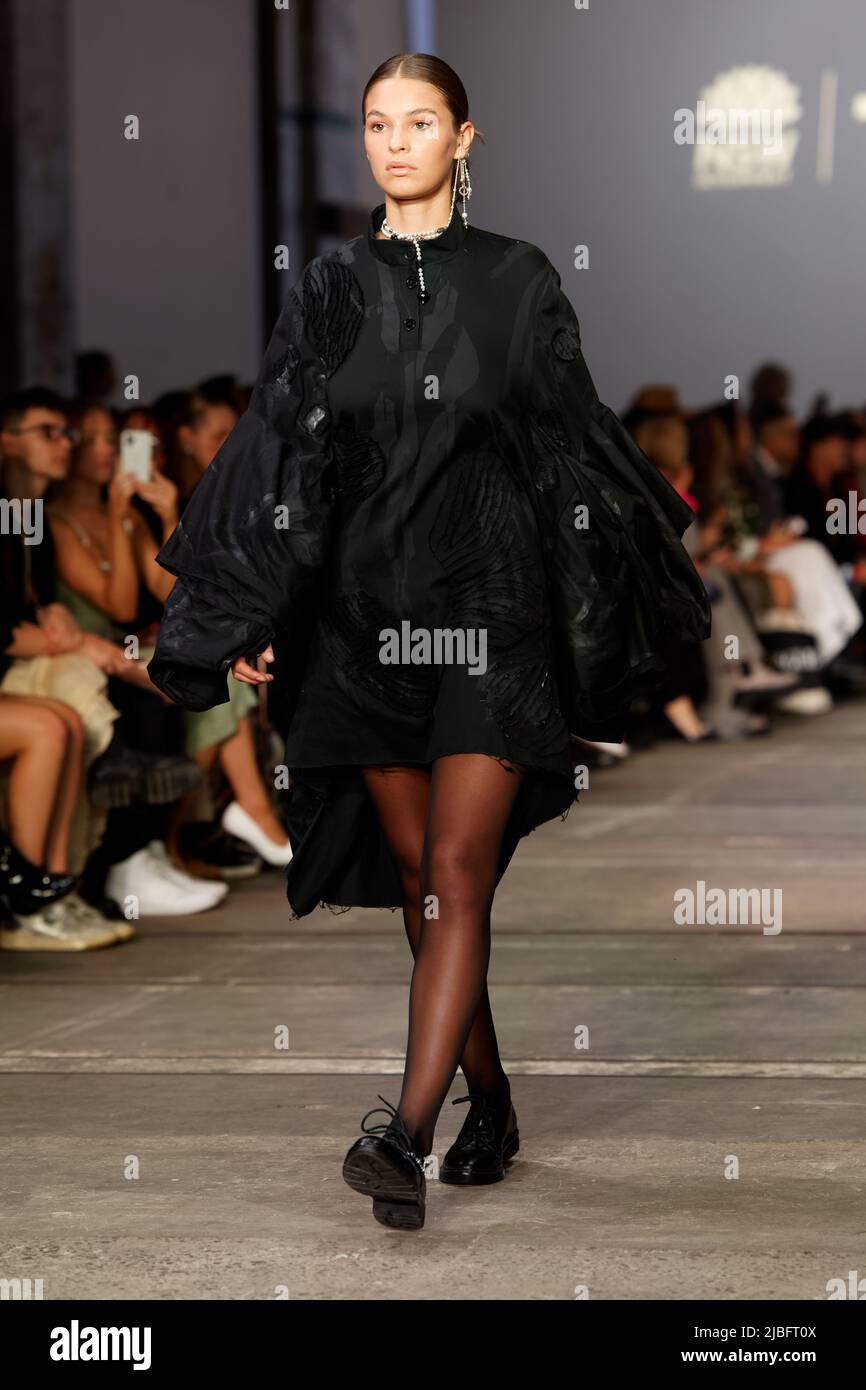 A model walks the runway in a design by ARCHIVE / Seung Michael Jun during The Innovators: Fashion DesignStudio TAFE NSW show during Afterpay Australi Stock Photo