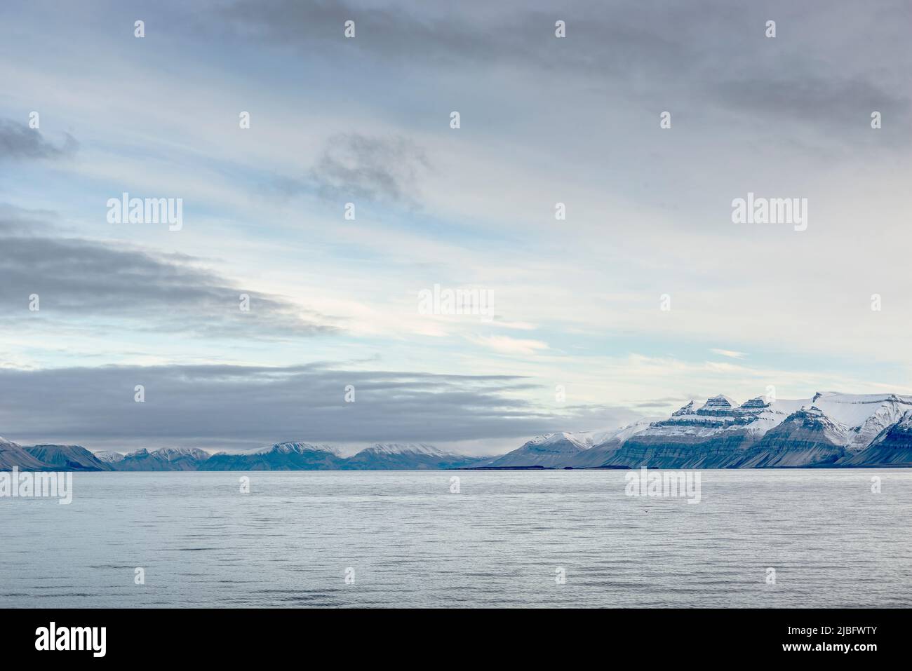 Snowy mountains and sea in Svalbard, Norway Stock Photo