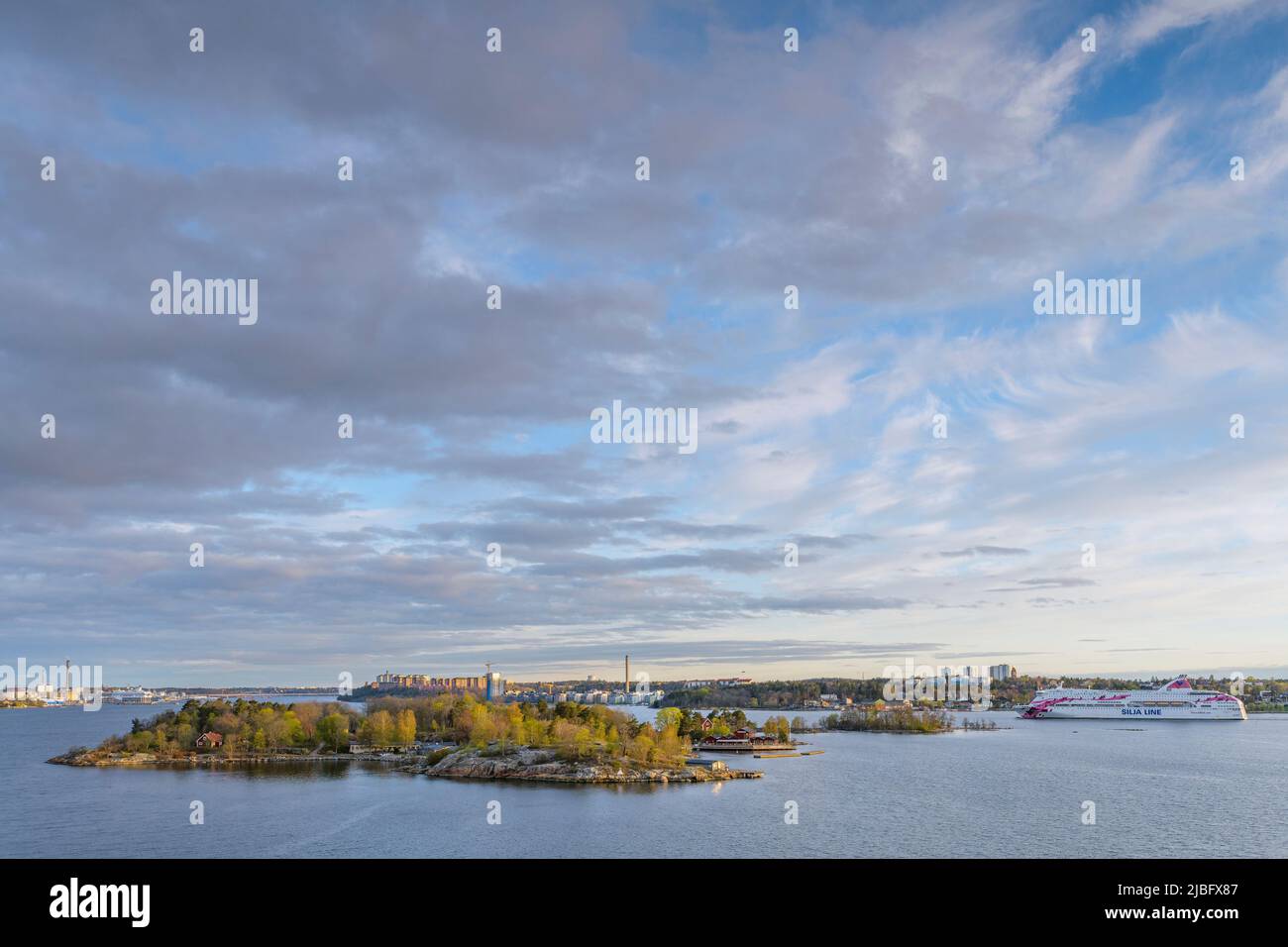 Clouds above island in Stockholm, Sweden Stock Photo