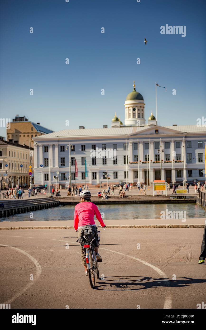 Cyclist on street in Helsinki, Finland Stock Photo