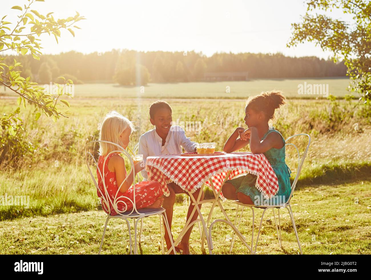 Child picnic table ethnicity hi-res stock photography and images - Alamy