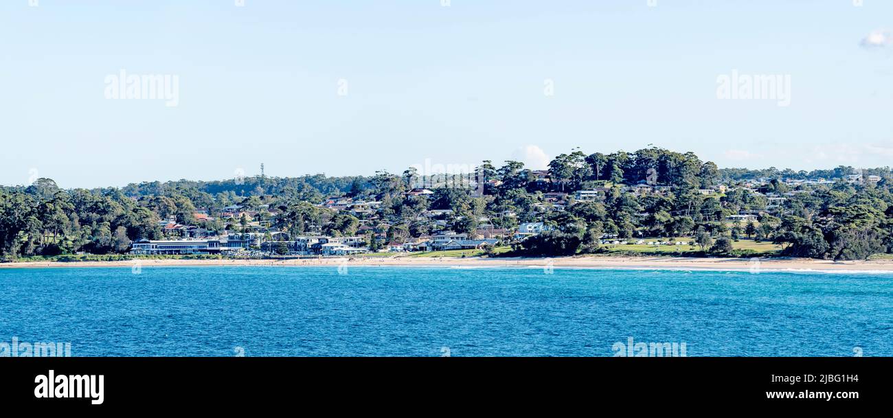 A panoramic view of Mollymook Beach, its Surf Club and the local golf club clubhouse (LHS) on the New South Wales, South Coast of Australia Stock Photo